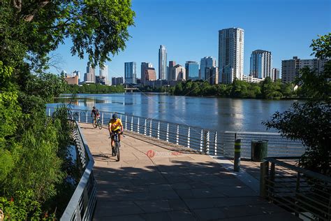 Bikers race the Boardwalk Trail at Lady Bird Lake in downtown Austin ...