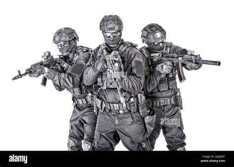 Group of SWAT team fighters in black uniforms, armed with assault ...