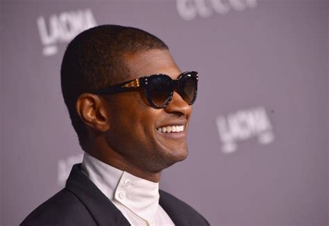 Why people like it when Usher turns his back to them (hint: a tattoo is ...