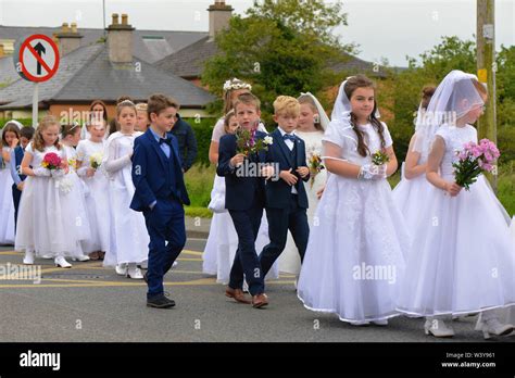 Catholic children in the First Holy Communion dresses take part in the ...