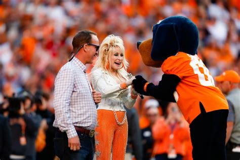 Peyton Manning Escorts Dolly Parton Onto Field For 'Rocky Top' Pe