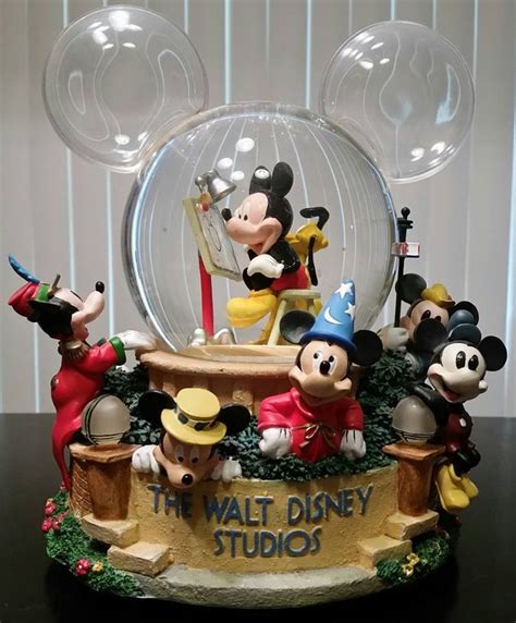 This #DisneyStore Musical #SnowGlobe called "#MickeyMouse Through the Years" plays the "# ...