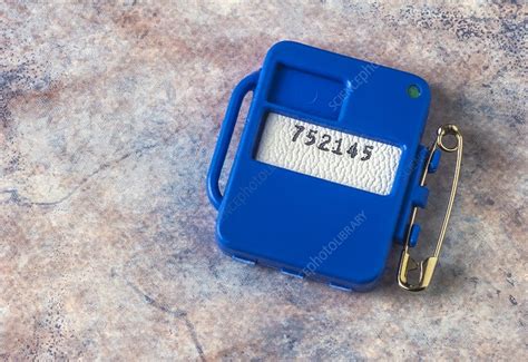 Radiation monitor badge - Stock Image - T168/0037 - Science Photo Library