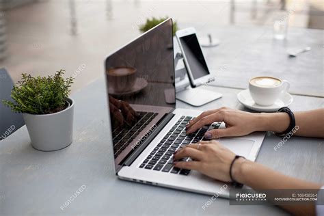 Hands typing on laptop keyboard — communication, smartphone - Stock Photo | #168438264