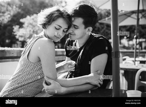 couple sitting in a cafe outside Stock Photo - Alamy