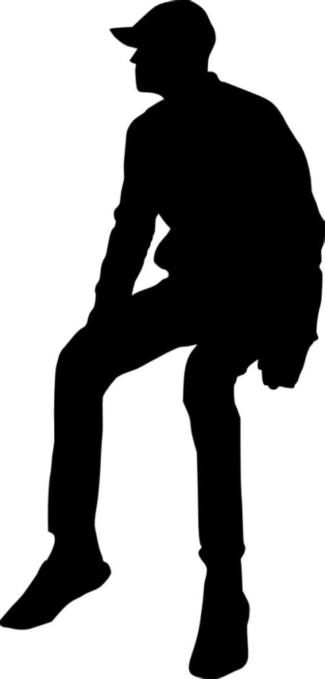 the silhouette of a man with a hat and boots sitting on his knees ...