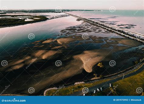 There is an Aerial Photo Showing the Highway and Bridge Along the Water Stock Photo - Image of ...