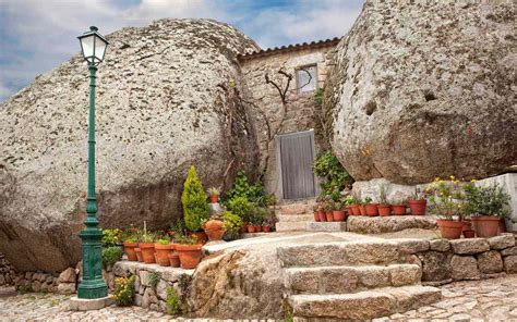 These Houses in Portugal Are Built Into Giant Boulders | Travel + Leisure