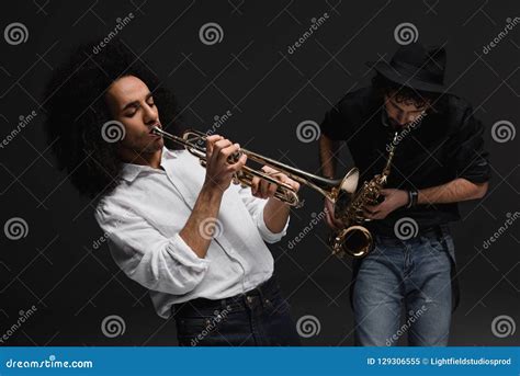 Duet of Musicians Playing Trumpet and Sax Stock Image - Image of multicultural, handsome: 129306555