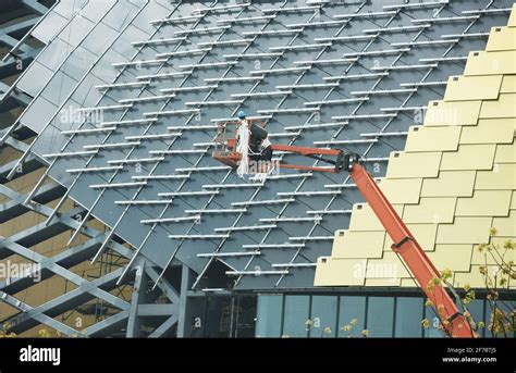 HANGZHOU, CHINA - APRIL 6, 2021 - Construction workers install the ...