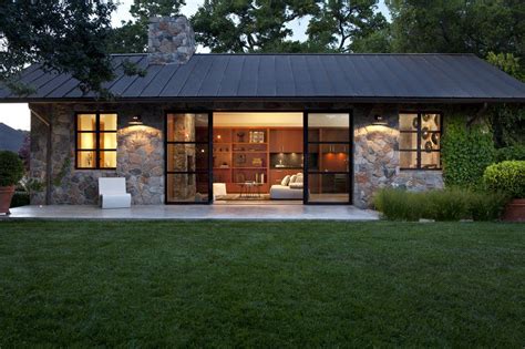 Fieldstone Guest Cottage, Sonoma, CA. Exterior Stone Façade, Metal Roof, Modern Steel Sliding ...