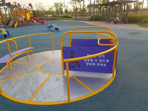 This wheelchair accessible playground carousel : mildlyinteresting