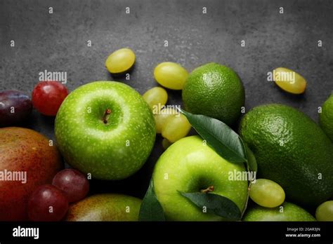 Fruits on dark grey background Stock Photo - Alamy