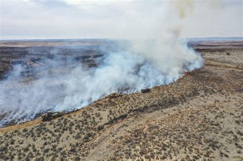 Firefighters battle largest wildfire in Texas history