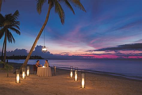 A romantic dinner for two on the beach under a cotton candy sky in Akumal. | Dream honeymoon ...