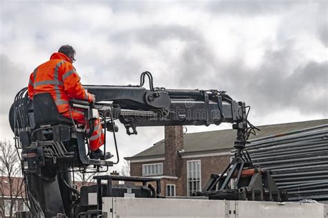 Crane Operator Unloads His Truck Editorial Image - Image of people, colour: 117471470