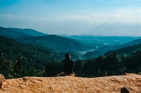 Person Sitting By The Cliff · Free Stock Photo