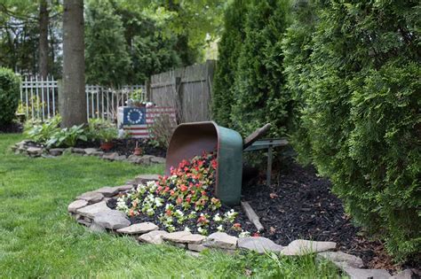 DIY Tipped Wheelbarrow Planter - The Honeycomb Home