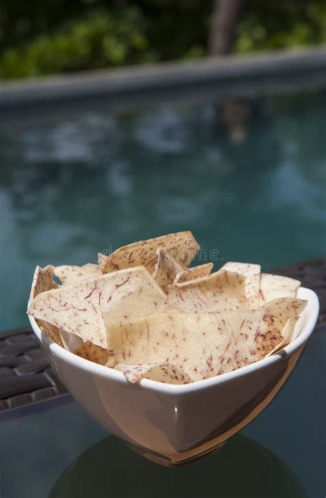 Malanga Chips by the Pool stock photo. Image of bowl - 127485656