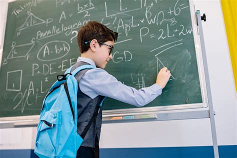 Smart Boy Solving a Math Problem · Free Stock Photo