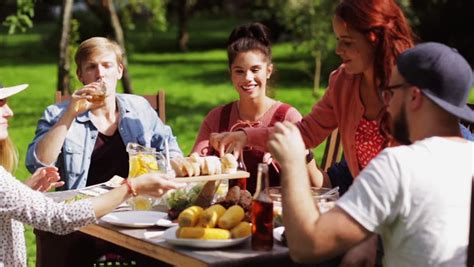 Group Of People Eating Outdoors In Summer. Shot On RED EPIC For High ...