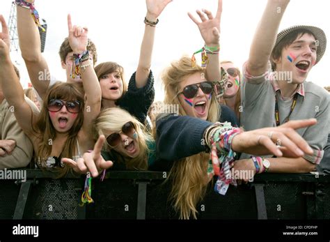 Crowd in front row screaming at a music concert Stock Photo - Alamy