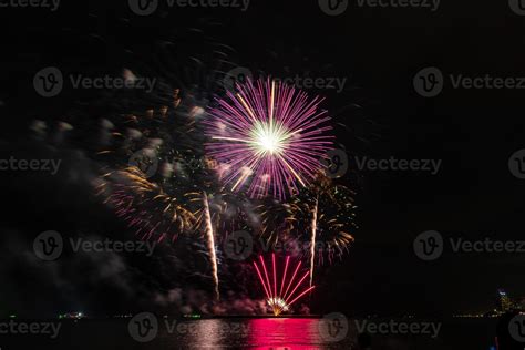 fireworks celebration over sea in pattaya beach 13284636 Stock Photo at Vecteezy