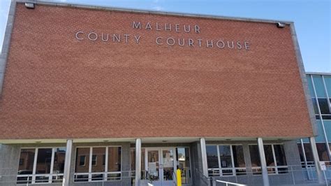 At the Malheur County Courthouse, tasks go on as some employees work ...