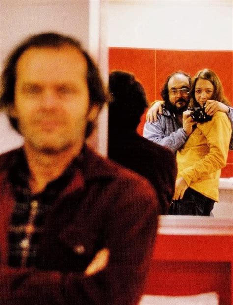 Stanley Kubrick taking a mirror selfie with his daughter, Vivian Kubrick, while Jack Nicholson ...