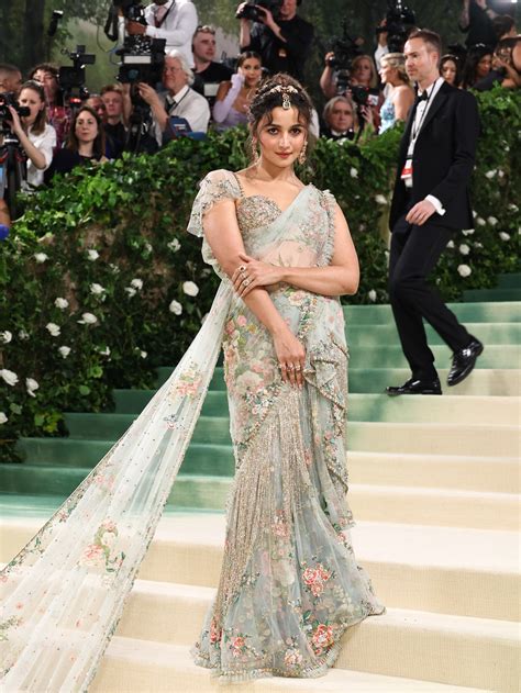 Alia Bhatt wore a custom Sabyasachi sari featuring precious gemstones and a 23-foot-long train ...