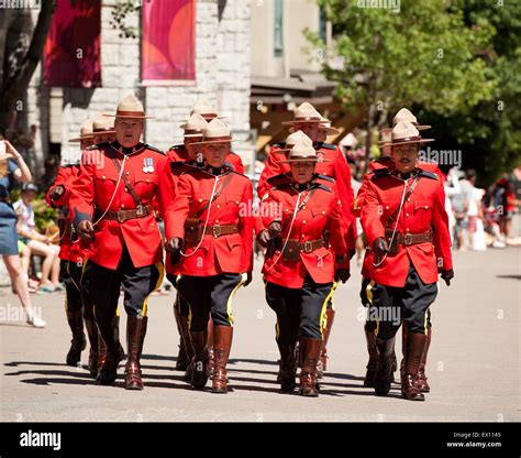 Royal Canadian Mounted Police officers parade in ceremonial red serge uniforms for Canada Day ...