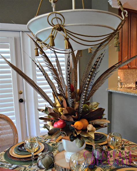 A Fall Centerpiece of Magnolia Leaves and Feathers - Celebrate & Decorate