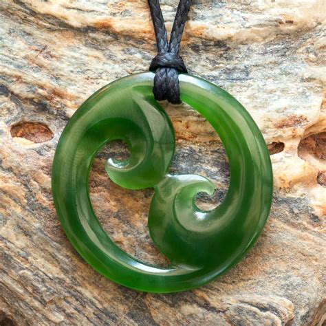 A small hand crafted New Zealand Maori style carved jade double Koru ...