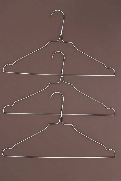 Best Wire Coat Hanger Stock Photos, Pictures & Royalty-Free Images - iStock