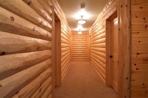 Half Log Interior Paneling | Hallway - 8-inch half log hewn pine log siding, with 4-inch half ...