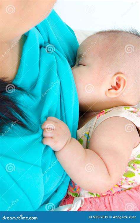 Baby drinking breastmilk stock image. Image of milk, healthy - 63897819