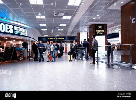 Manchester International Airport T1 arrival hall with passengers arriving Stock Photo - Alamy