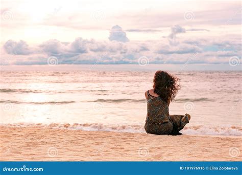 Beautiful Young Woman Sitting on the Beach at Sunset Time Stock Photo - Image of nature ...