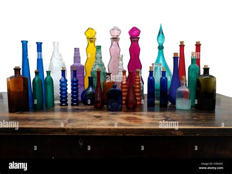 A Collection Of Glass Bottles All Different Shapes, Sizes And Colours ...