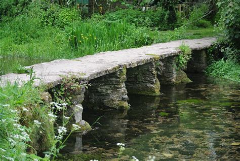 Clapper Bridge Crossing Of Shallow River Photograph by Lynne Iddon ...