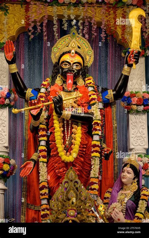 Idol of Goddess Maa Kali at a decorated puja pandal in Kolkata, West Bengal, India. Kali puja ...