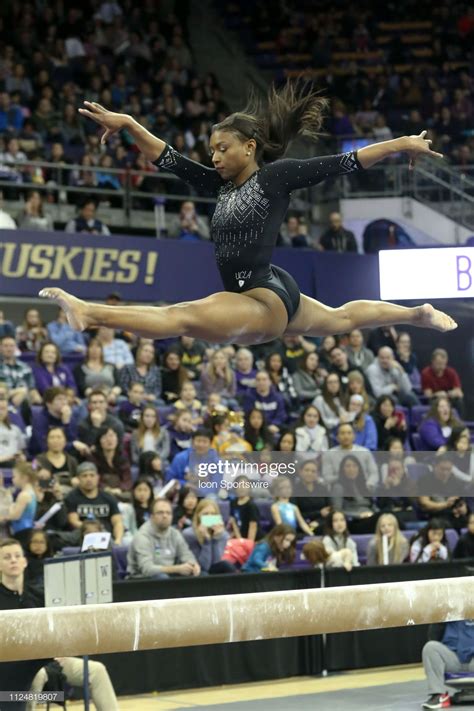 UCLA gymnast Nia Dennis performs her routine on the balance beam ...