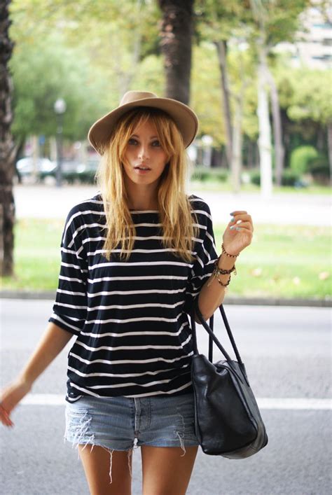 Street style | Oversize striped shirt, shredded denim shorts and hat ...