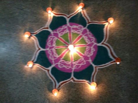 Karthigai Deepam Kolam!! A free hand rangoli, with Deepam.I have used my favorite colours to ...