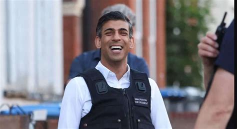 Rishi Sunak seen laughing as he watches immigration raid