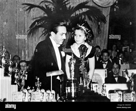 Shirley Temple (right) at the Academy Awards, presenting Walt Disney ...