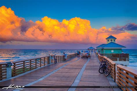 Juno Beach Pier Clouds Light Up at Sunset | Royal Stock Photo