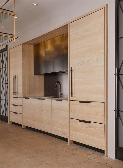 This is the functional Ombre Kitchen at our NYDC showroom, featuring bleached oak cabinetry with ...