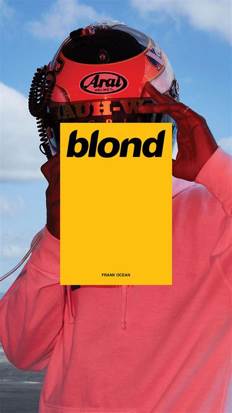 a person holding up a yellow sign with the words blonde on it in front of their face