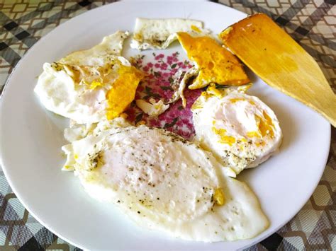 Fried Eggs from Three Eggs on a Plate with a Wooden Spatula Stock Image - Image of brown, fried ...